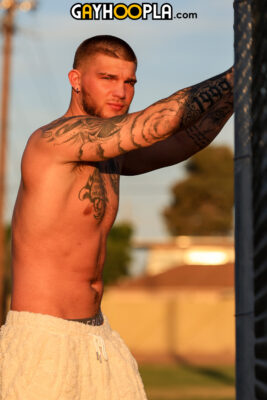 handsome straight rugged muscle tattoed jock Mac Lawler from GayHoopla posing outside
